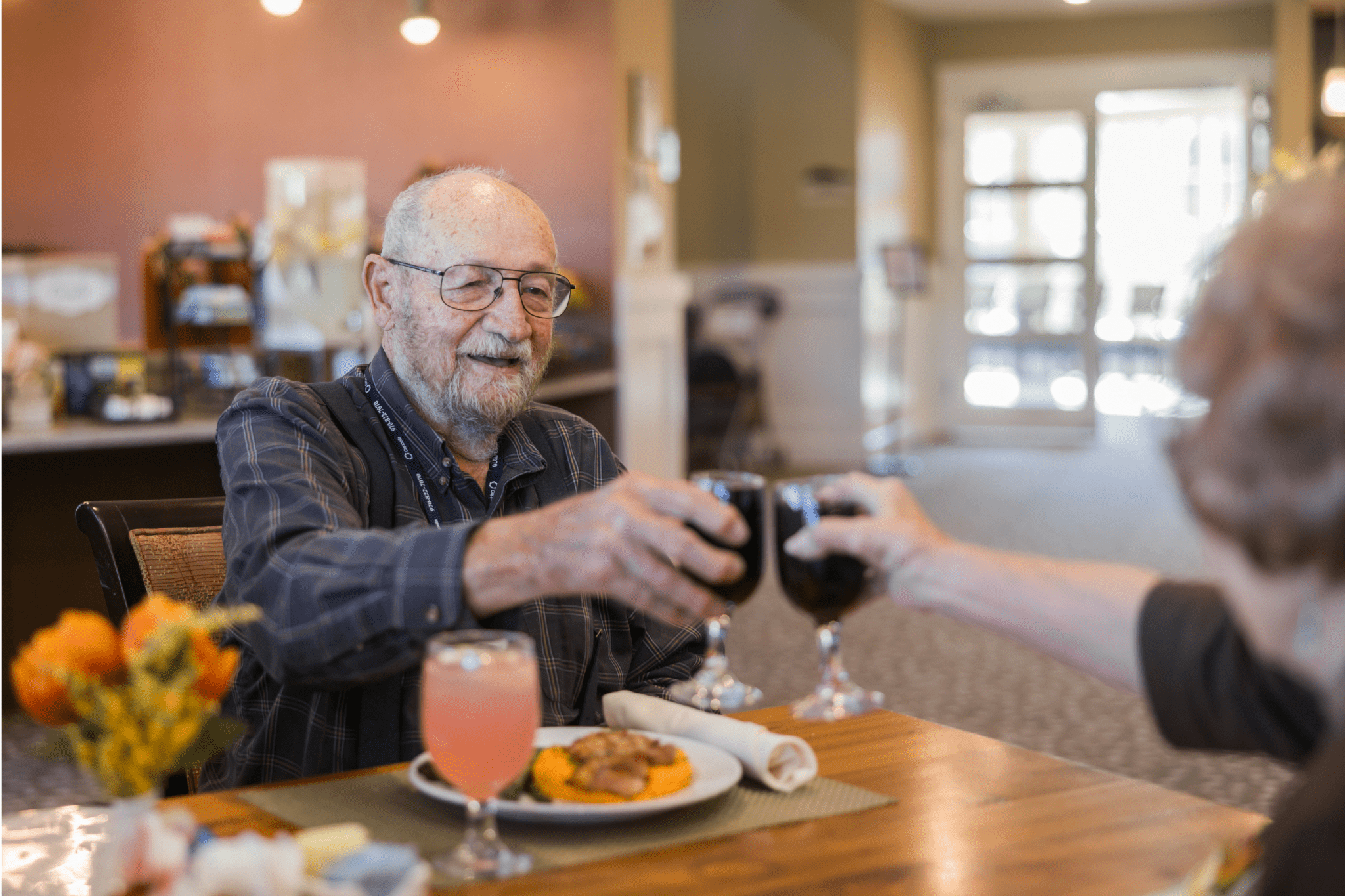 residents clanking beverage glasses large landscape